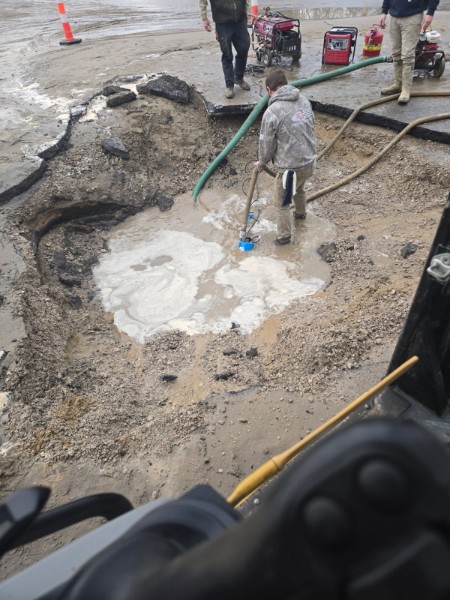 Crew working around an open excavation