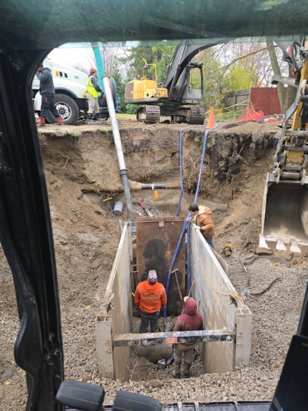 Shored trench viewed from the excavator cab